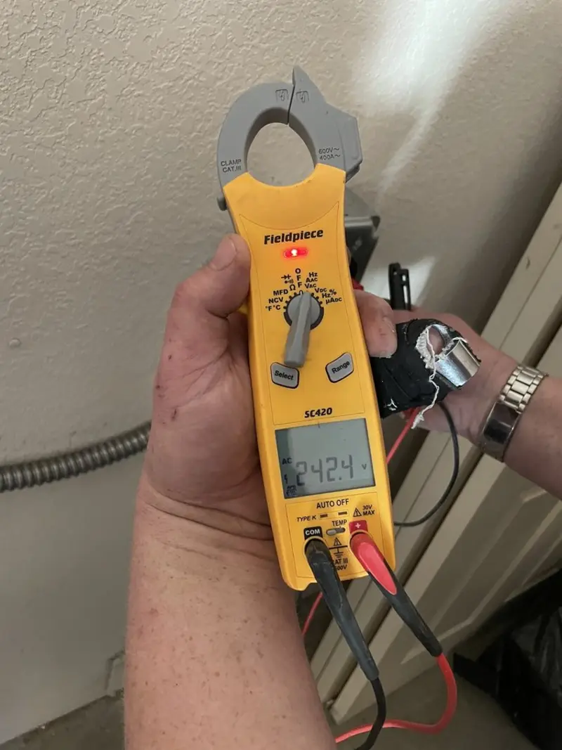 Voltage testing with clamp meter during Generator Installation in Plantation